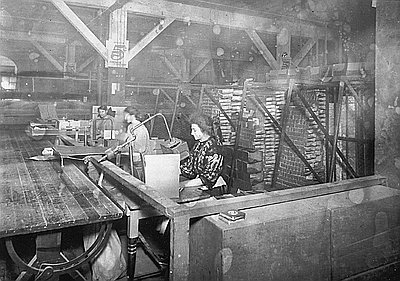This photograph of three women packers at the Pacific Coast Biscuit Company was probably taken sometime between 1900 and 1905. The Pacific Coast Biscuit Company operated plants in Portland that manufactured cookies, crackers, candy, and macaroni.