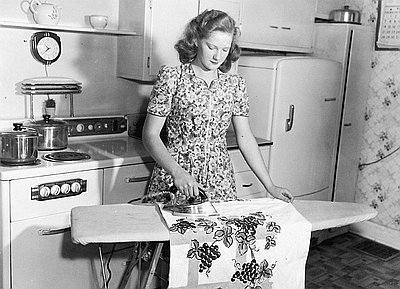 Woman Irons in Electrified Kitchen, c. 1940