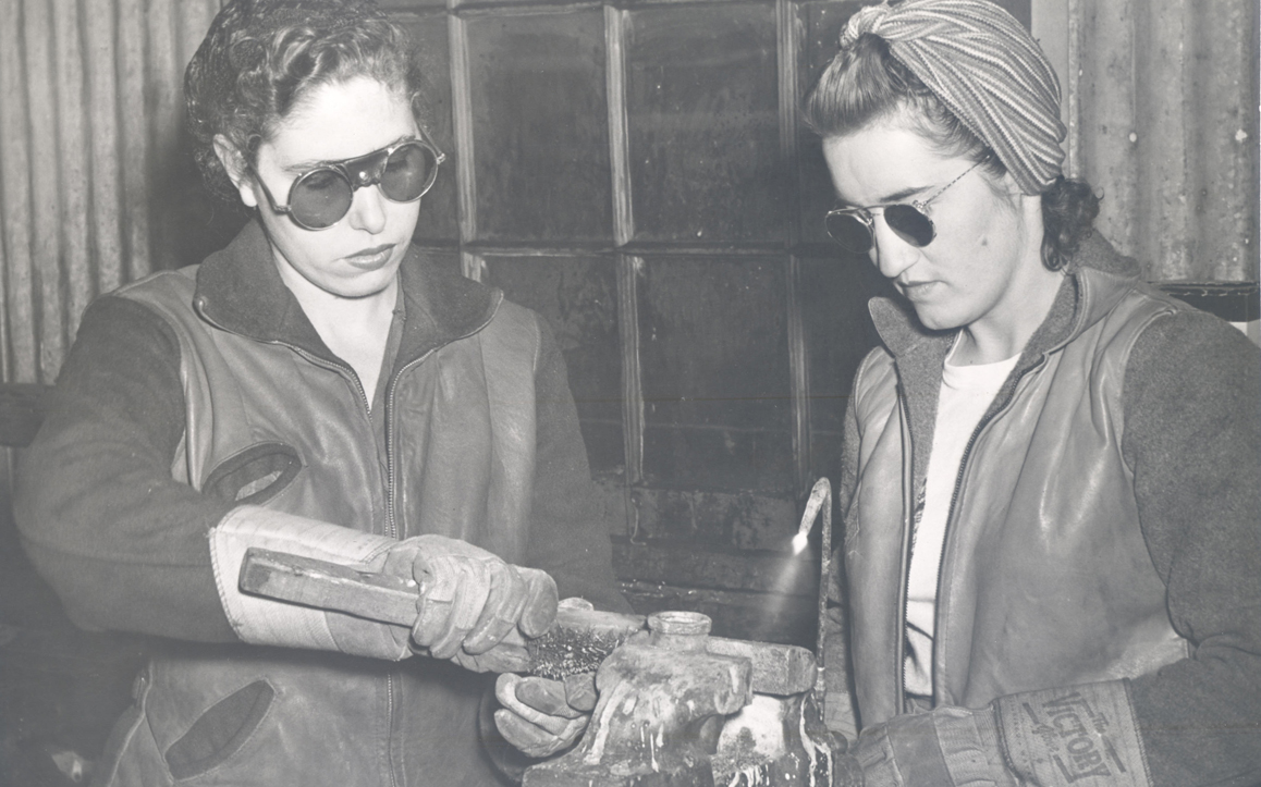 Two women work together at the Albina Engine & Machine works.