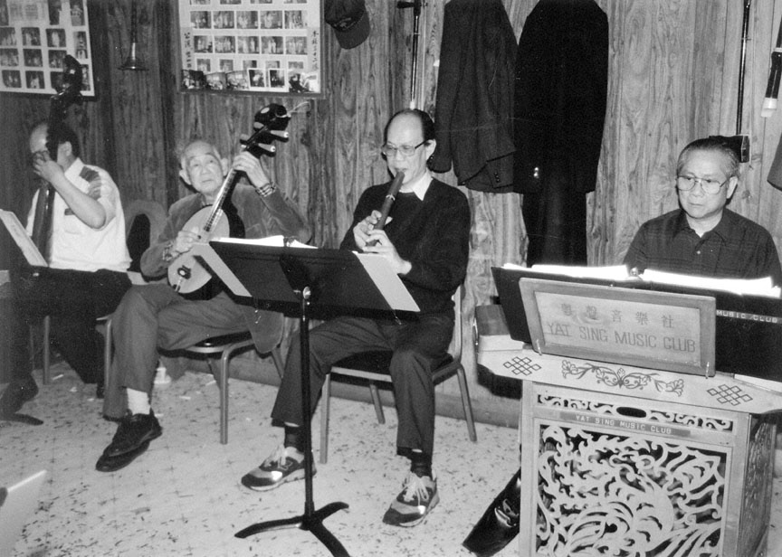 This photograph of the Yat Sing Music Club was taken by Nancy Nusz in 1994. The music club has been performing Cantonese opera in Portland since World War II.