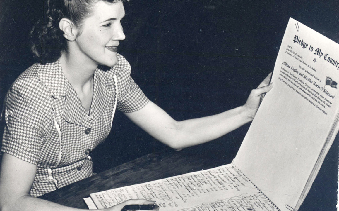 Fieger worked for Albina Engine & Machine Works in Portland, and she poses here for a publicity photo. In an effort to prevent absenteeism on the job, which cost the company time and money, Albina followed the example of other wartime industries and asked its workers to sign a national pledge to turn in full timecards.