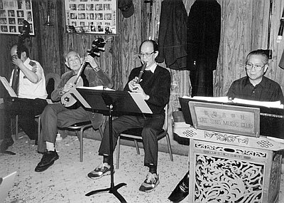 This photograph of the Yat Sing Music Club was taken by Nancy Nusz in 1994. The music club has been performing Cantonese opera in Portland since World War II.