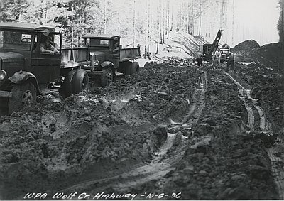 Workmen Battle Mud, Wolf Creek Highway